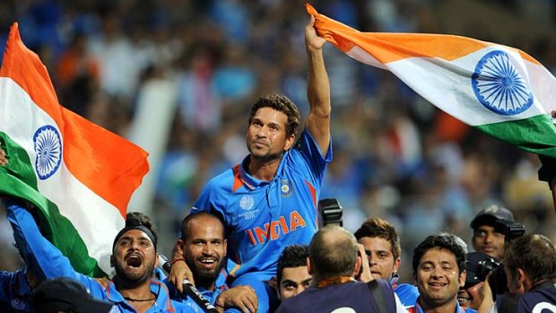 Last mountain conquered . . . Sachin Tendulkar, seen here with Harbhajan Singh, finally added a World Cup win to his glittering CV with India's victory over Sri Lanka.