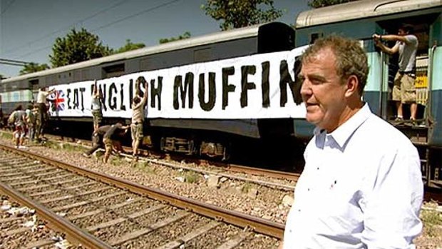 Top Gear host Jeremy Clarkson and the controversial 'muffins' banner in India.
