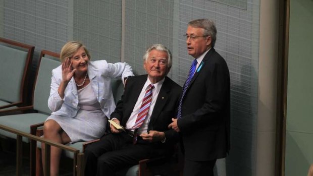 Treasurer Wayne Swan talks with former PM Bob Hawke and his personal assistant Jill Saunders at Parliament House in Canberra.