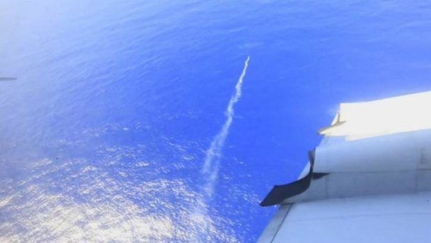 A marker flare is deployed into the Indian Ocean from a Royal New Zealand Air Force plane searching for plane debris off the west coast of Australia.