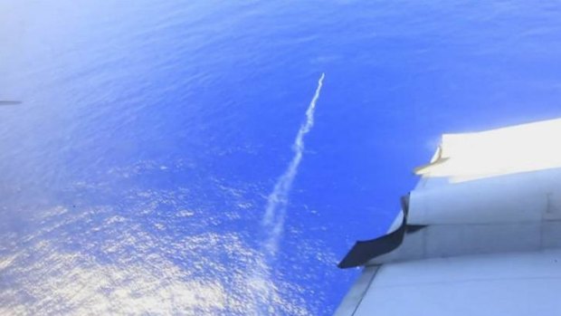 A marker flare is deployed into the Indian Ocean from a Royal New Zealand Air Force plane searching for plane debris off the west coast of Australia.