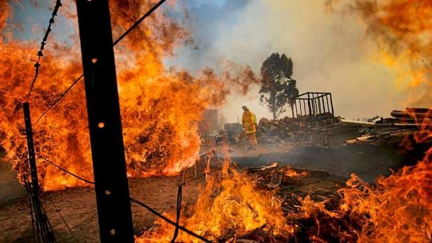 Bushfires threaten properties near Kilmore South on Monday.