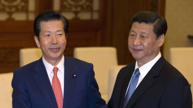 Natsuo Yamaguchi leader of Japan's New Komeito party, shakes hands with China's president-in-waiting Xi Jinping in Beijing, January 25, 2013.