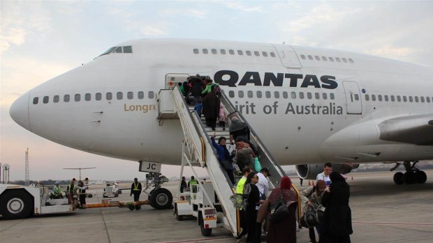 Relieved Australians board a Qantas 747 jumbo at Cairo International Airport in February 2011.