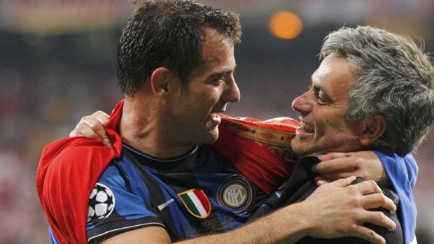 Inter Milan's manager Jose Mourinho hugs Dejan Stankovic after their Champions League final victory.