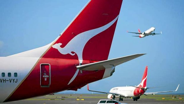 Job cuts loom: Treasurer Joe Hockey has thrown Qantas a lifeline in the form of a debt guarantee.