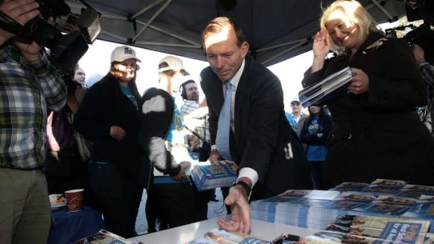 Opposition Leader Tony Abbott meets supporters at a campaign rally in Rockingham, WA.