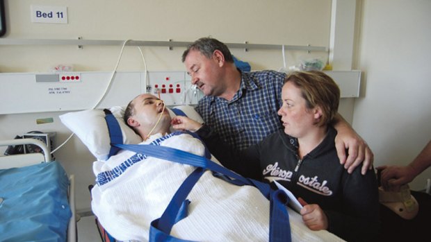 Victim of senseless violence...David Keohane with his family in an induced coma in 2008