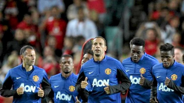 Painting the town red: Manchester United train before thousands at Allianz Stadium on Friday night.