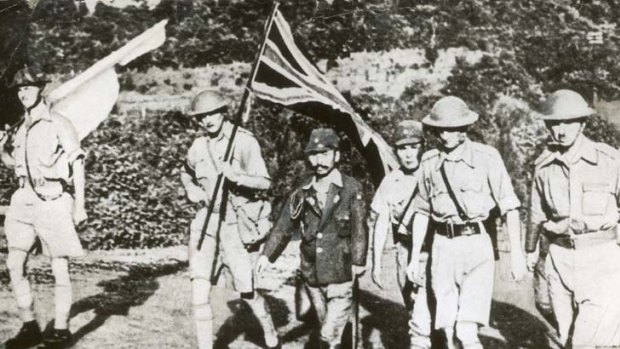 Grim fate ... British officers, including Lieutenant-General Arthur Percival, are escorted to the formal surrender of Singapore.