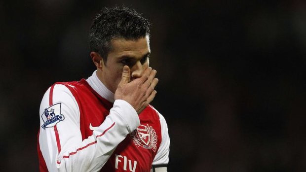 Robin Van Persie reacts after hitting the bar against Bolton.