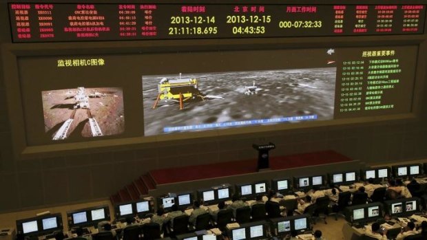 Researchers work in the control room of the Chang'e-3 lunar probe after it landed on the moon and deployed a moon rover, at the Beijing Aerospace Control Center in Beijing. 