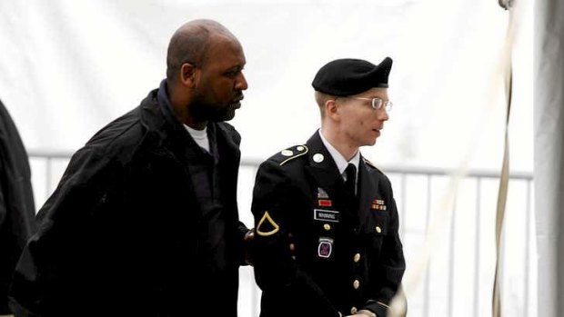 US Army Private First Class Bradley Manning arrives at the courthouse for a motion hearing at Fort Meade in Maryland. Manning, 25, is accused of providing diplomatic cables and other secret documents to the WikiLeaks website.