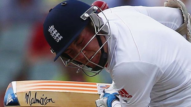 Stuart Broad reacts as he is hit by a ball from Mitchell Johnson.