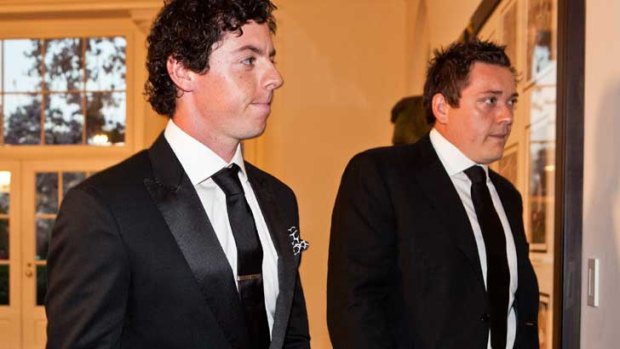 McIlroy (L) with former manager Conor Ridge visit the White House in 2012.