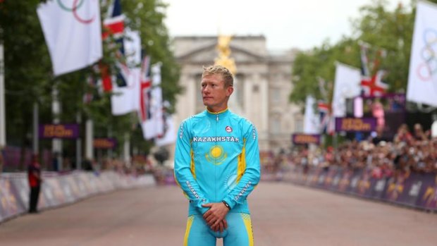 Kazakhstan's Alexandr Vinokourov celebrates his men's road race victory at the London Olympics.