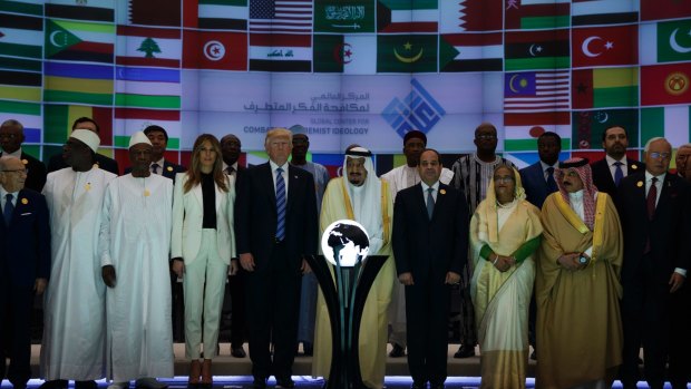 President Donald Trump and Saudi King Salman pose for photos near the orb.
