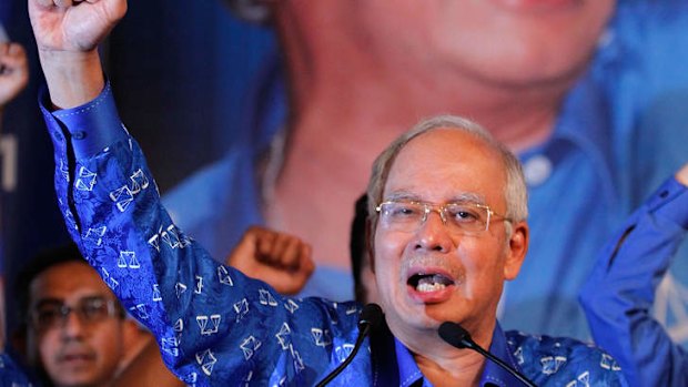 Malaysia's Prime Minister and Barisan Nasional chairman Najib Razak celebrates his victory on election day.