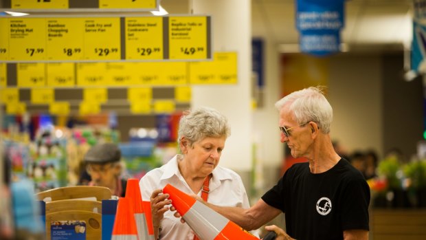 Peter and Mary Ford inspecting witches hats at Aldi. 