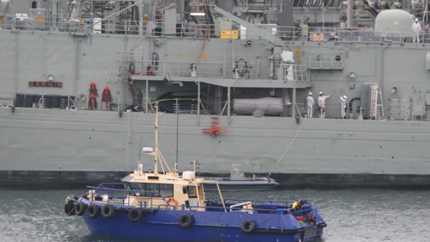 Shark attack ... the person was reportedly attacked near HMAS Darwin  in Woolloomooloo Bay.