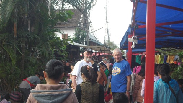 Greg Packer (left) and Stuart McPherson in Luang Prabang marketplace, Laos