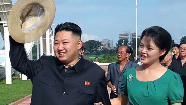 Next dyanastic succession? ... Kim Jong-Un with his wife Ri Sol-Ju, pictured last July, who is suspected to have recently given birth.
