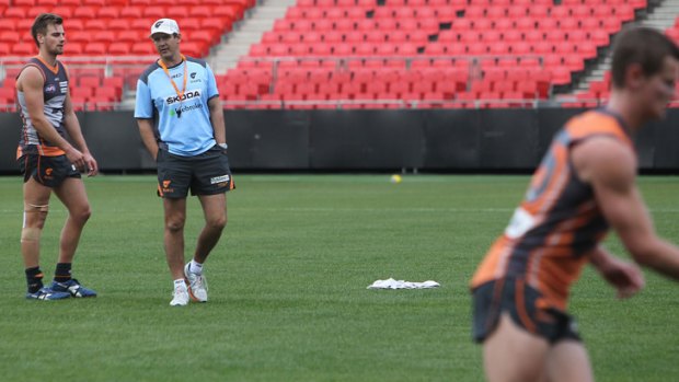 Eye to the future: Leon Cameron oversees Giants training.