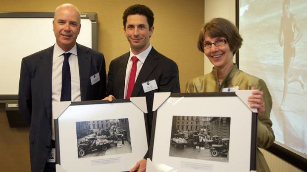Fairfax CEO Greg Hywood (left) presents framed photographs to Ryan Stokes, Chairman of the National Library of Australia and Anne-Marie Schwirtlich, Director General of the National Library of Australia, at the handing over of the Fairfax glass plate negative collection to the National Library on Monday.