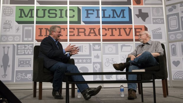 Former US Cice President Al Gore, left, speaks with Wall Street Journal columnist Walt Mossberg during an interview at SXSW in 2013.