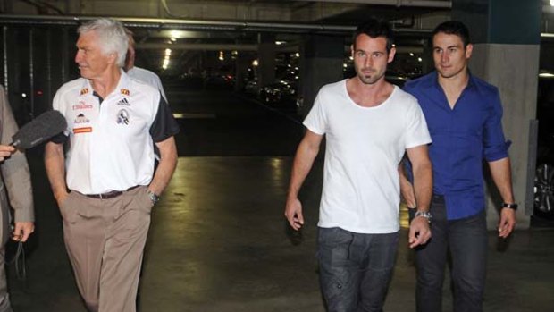 Collingwood coach Mick Malthouse (left) arrives at AFL House yesterday with Alan Didak and Paul Licuria to take part  in an investigation into incidents from last Friday's Collingwood-St Kilda clash.