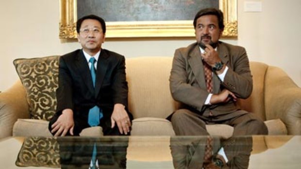 Look who's talking...a North Korean diplomat, Myong Gil-kim, and Bill Richardson at the governor's mansion in Santa Fe.