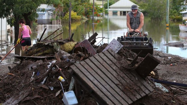 Bundaberg residents clean up after flooding rain brought by ex-tropical cyclone Oswald.