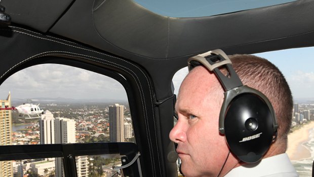 Campbell Newman in a helicopter over the Gold Coast this morning.