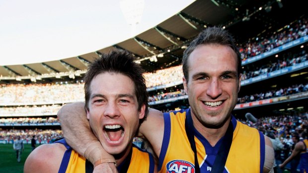 Ben Cousins and Chris Judd celebrate the 2006 flag.