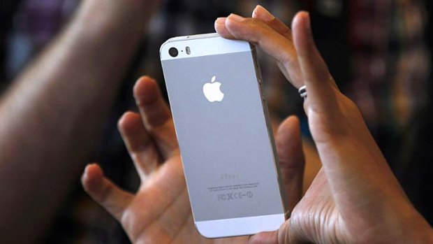 Upsize: The iPhone 6 will reportedly have a larger screen than the iPhone 5s (pictured).