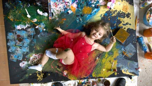 Aelita Andre at home with one of her many works.