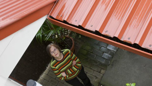 Falling apart ... Sandra Langtree, of Lilyfield, believes her gutters are to blame for a mouldy wall and timber rot.