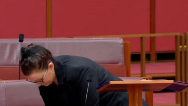 Down to business: Senator Jacqui Lambie switches off her phone.