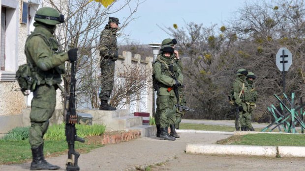 Russian troops block a Ukrainian base in Perevalnoye.