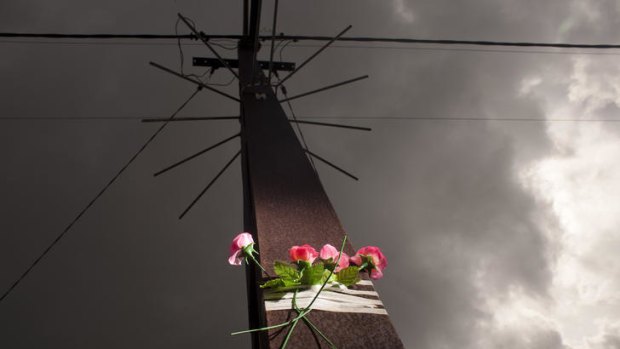A floral tribute on a power pole on Tiwi Island, where a young man committed suicide.