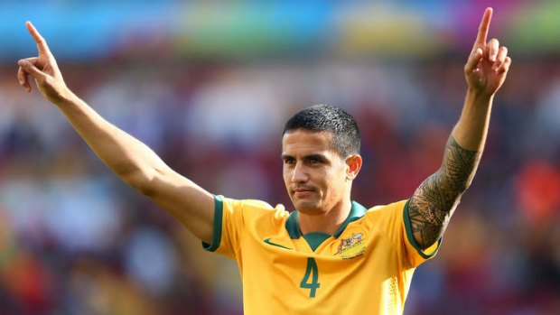 Tim Cahill acknowledges fans after Australia's defeat by the Netherlands.