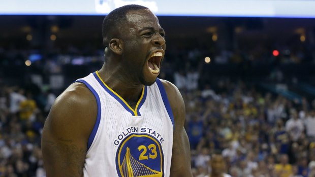 Golden State Warriors forward Draymond Green (23) yells after scoring against the Los Angeles Clippers during the second half of an NBA basketball game in Oakland, Calif., Sunday, March 8, 2015. The Warriors won 106-98. (AP Photo/Jeff Chiu)