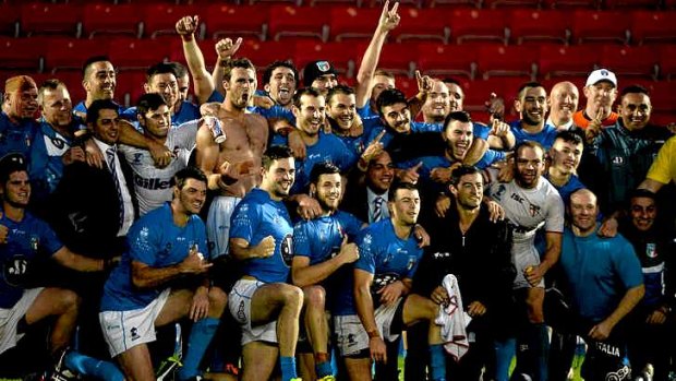 Giant killers: The Italian team celebrate after their shock win over England.