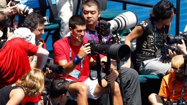 He's finally snapped ... Serbia's Novak Djokovic steps behind the lens at the Rally for Relief event.