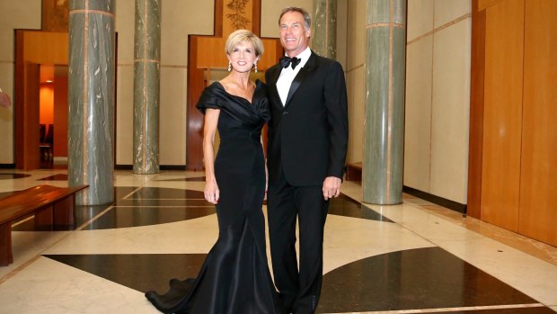 Foreign Affairs Minister Julie Bishop and David Panton arrive for the Midwinter Ball. 