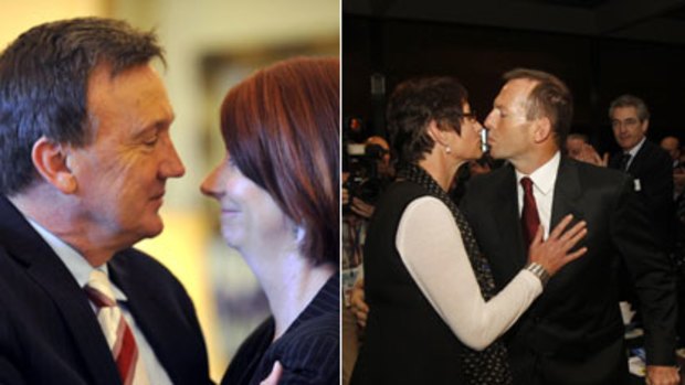 Supporters ... Julia Gillard and her partner, Tim Mathieson, embrace after she is sworn in as Prime Minister; Tony Abbott and his wife, Margie, in Perth at the weekend.