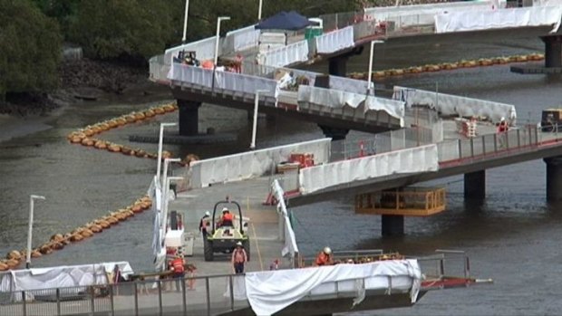 A contractual dispute threatens to derail the reopening of Brisbane's Riverwalk this Sunday.