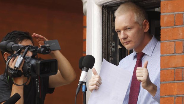WikiLeaks founder Julian Assange gestures after his statement to the media.