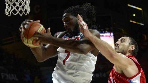 Serbia's centre Nenad Krstic (right) tries block a shot by Kenneth Faried.