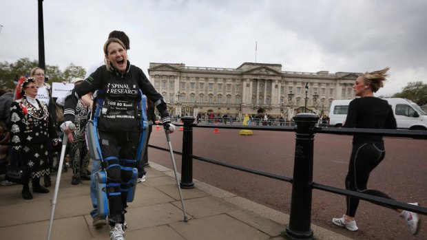 Bionic woman ... Claire Lomas shouts with joy as she passes Buckingham Palace.